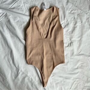 Urban outfitters pink v neck bodysuit, size small